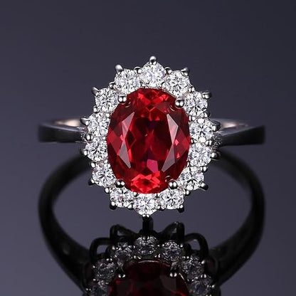 Anillo clásico con rubíes y borde de oro blanco