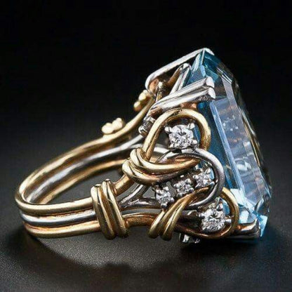 Anillo retro de oro con capas de zirconias azules