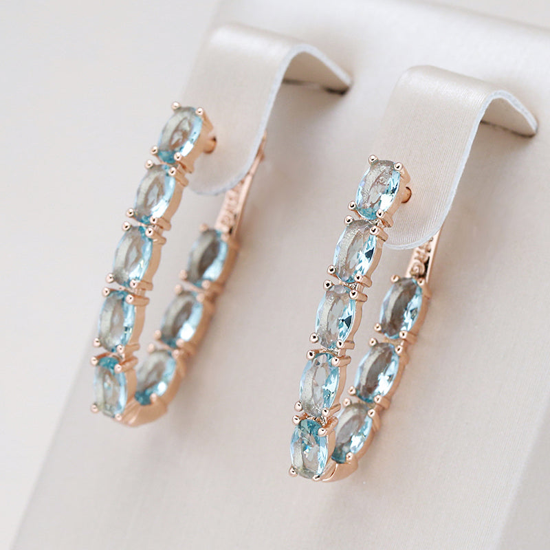 Aretes colgantes de turquesa y zirconia en oro