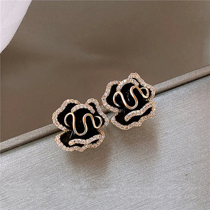 Aretes colgantes dorados « Flor de Loto Negra »