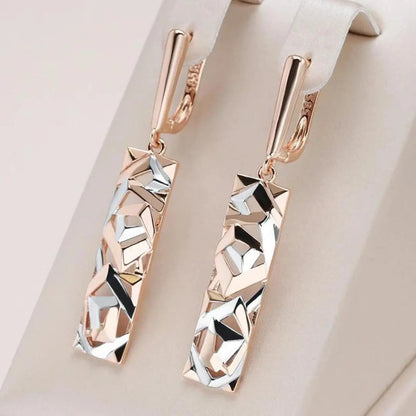 Aretes colgantes rectangulares de oro y plata