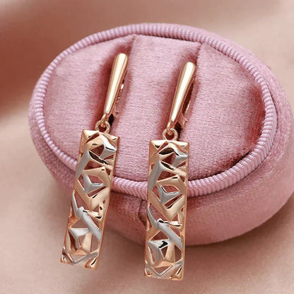 Aretes colgantes rectangulares de oro