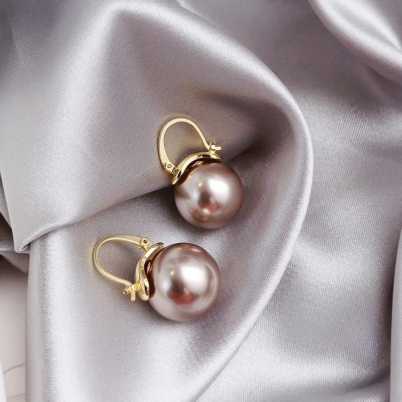 Aretes con margaritas de oro