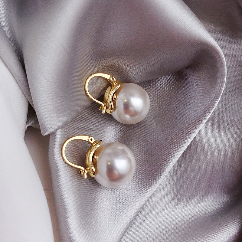Aretes con margaritas de oro