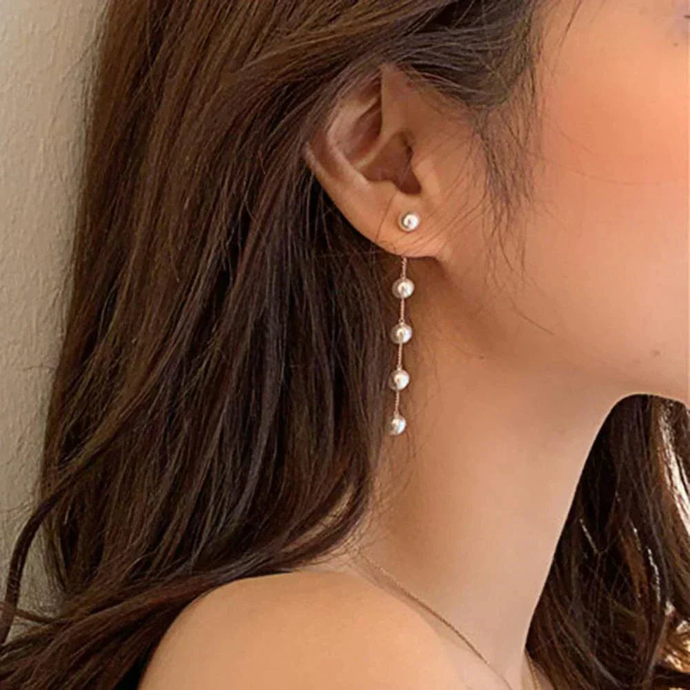 Aretes con motivos colgantes de margaritas