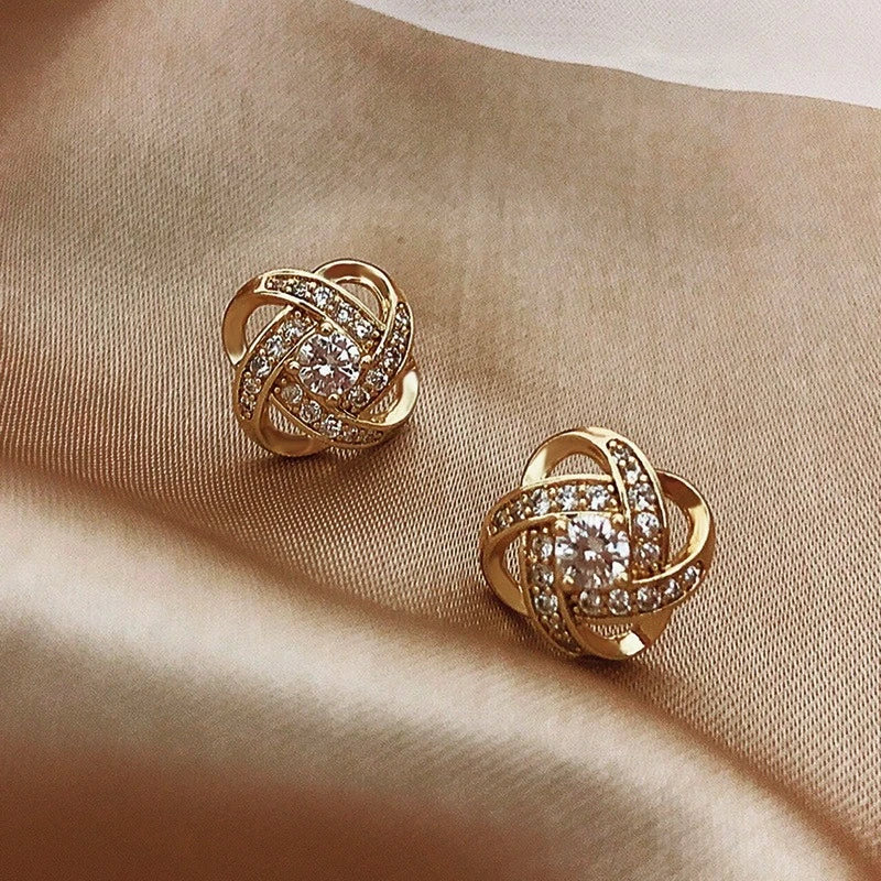 Aretes con perlas de zirconia en oro