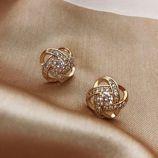Aretes con perlas de zirconia en oro