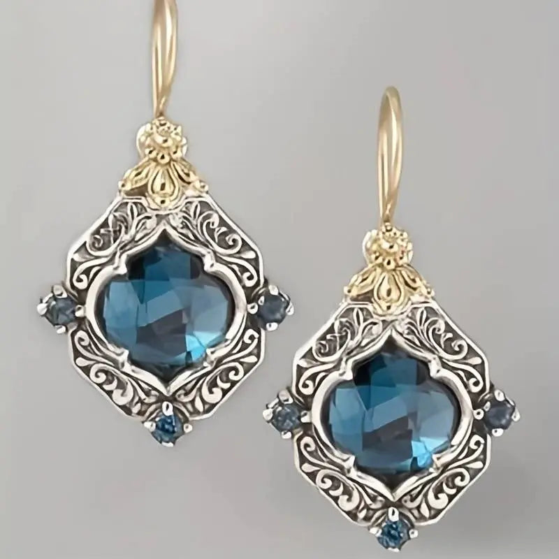 Aretes de cristales azules en oro y plata