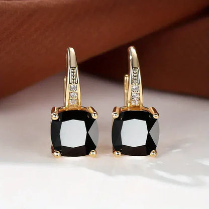 Aretes de oro con piedras misteriosas