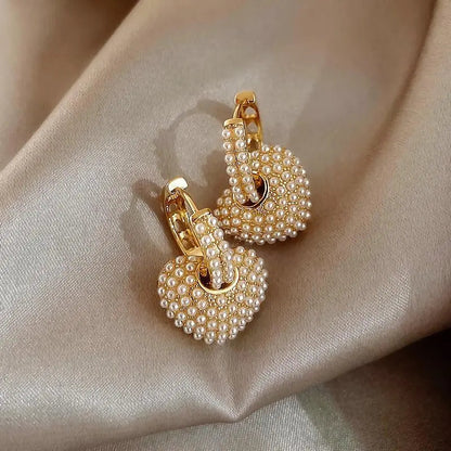 Aretes de perlas de amor en oro