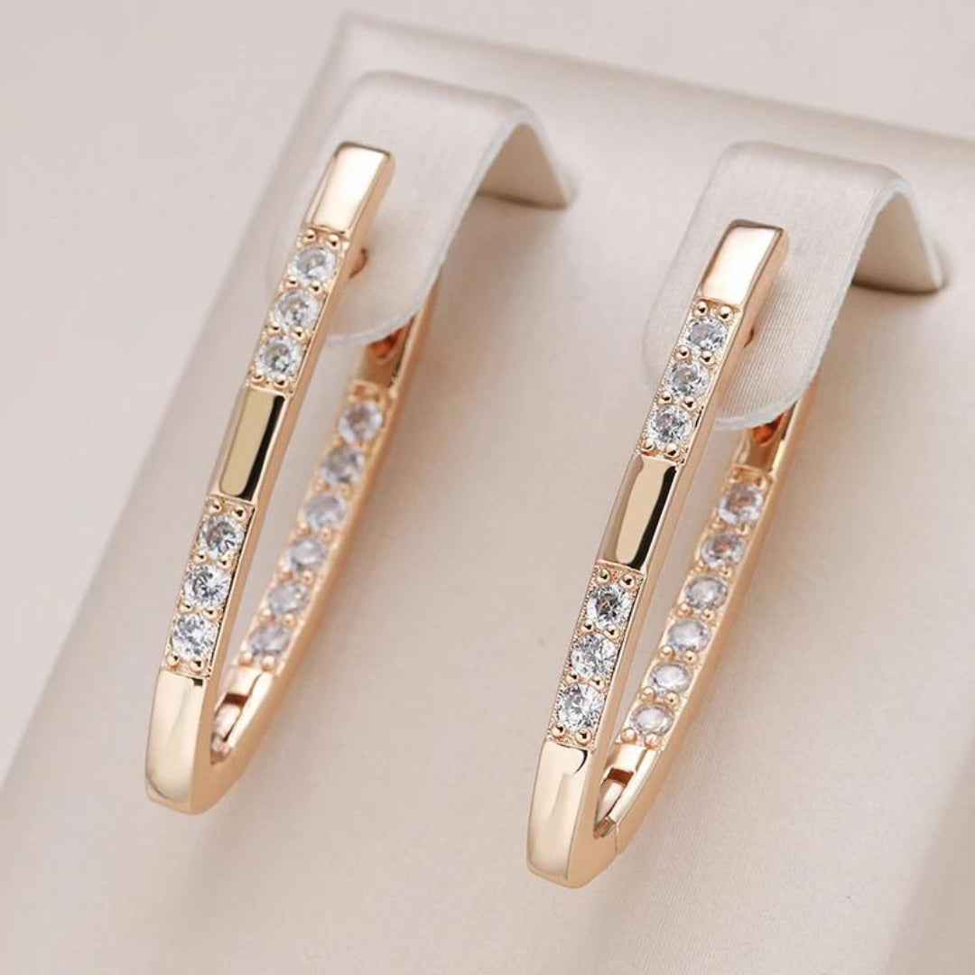 Aretes elegantes de zirconia en oro
