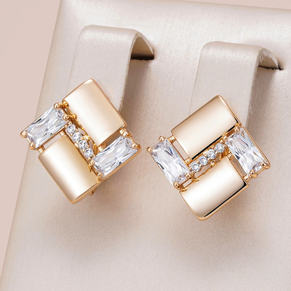 Aretes geométricos elegantes con zirconia en oro