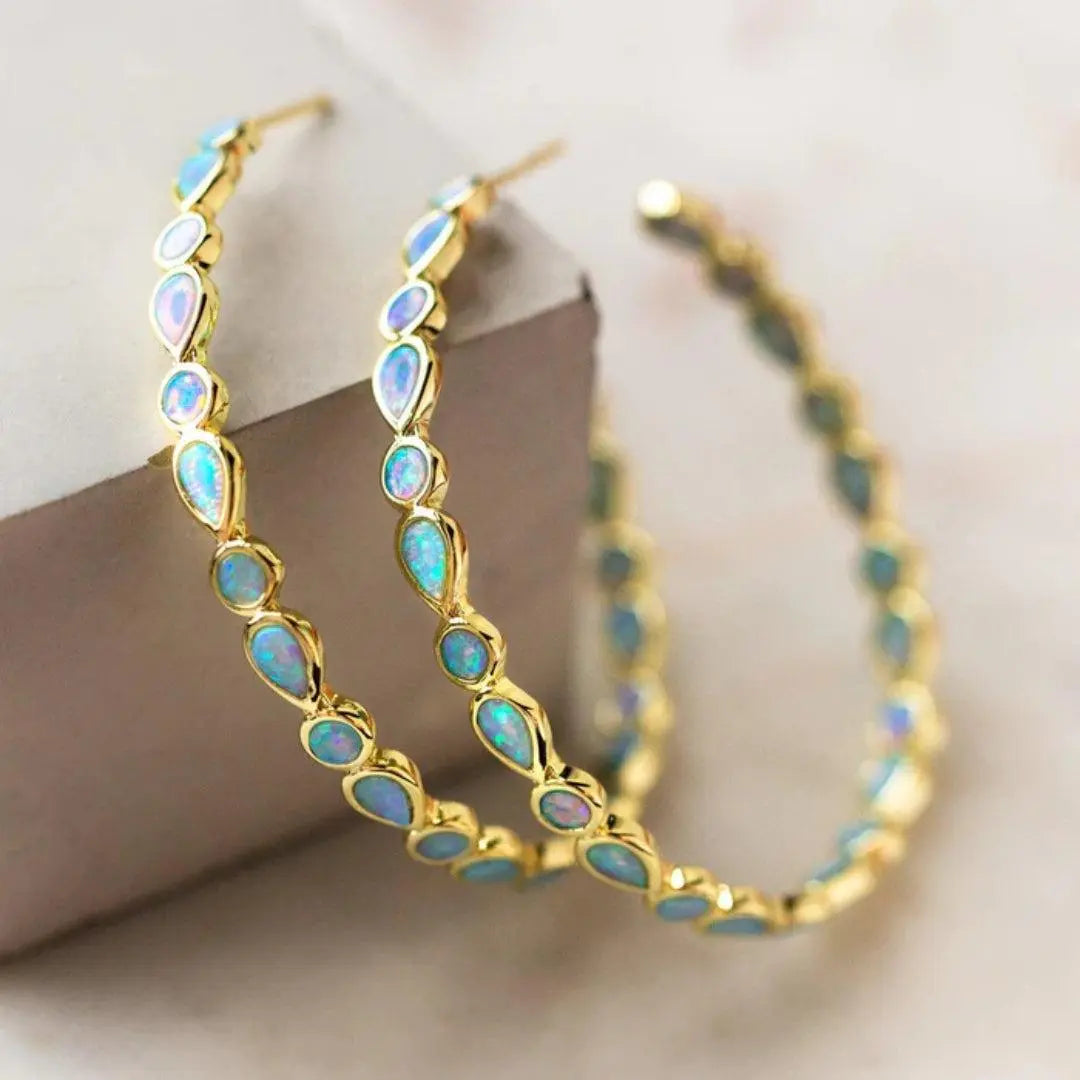 Aretes retro dorados con ópalo azul