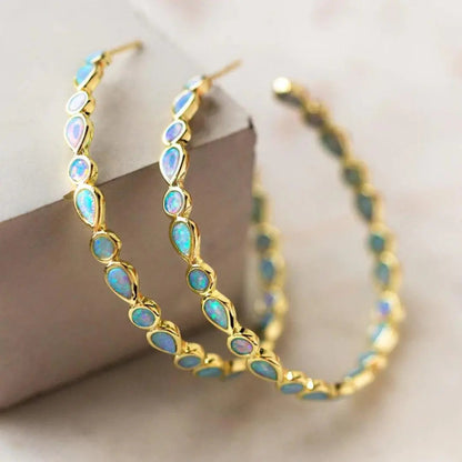 Aretes retro dorados con ópalo azul