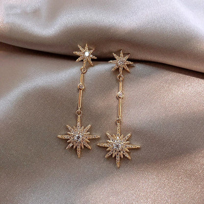 Aretes vintage de oro con estrella de cristal
