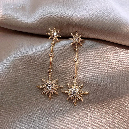 Aretes vintage de oro con estrella de cristal