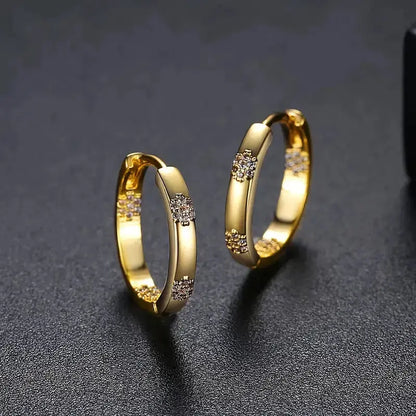 Aretes vintage de rueda con flor de oro
