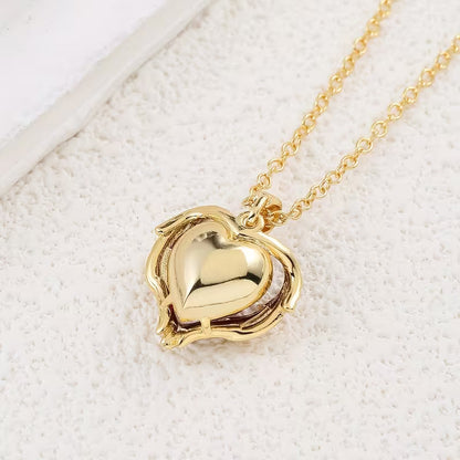 Collar con corazón de rubí ángel | Oro