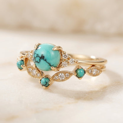 Conjunto de anillos dorados con turquesa