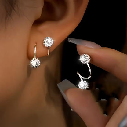 Conjunto de aretes ligeros de lujo con bolas en espiral y strass