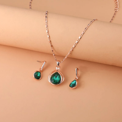 Conjunto de collar y aretes de cristal verde y oro