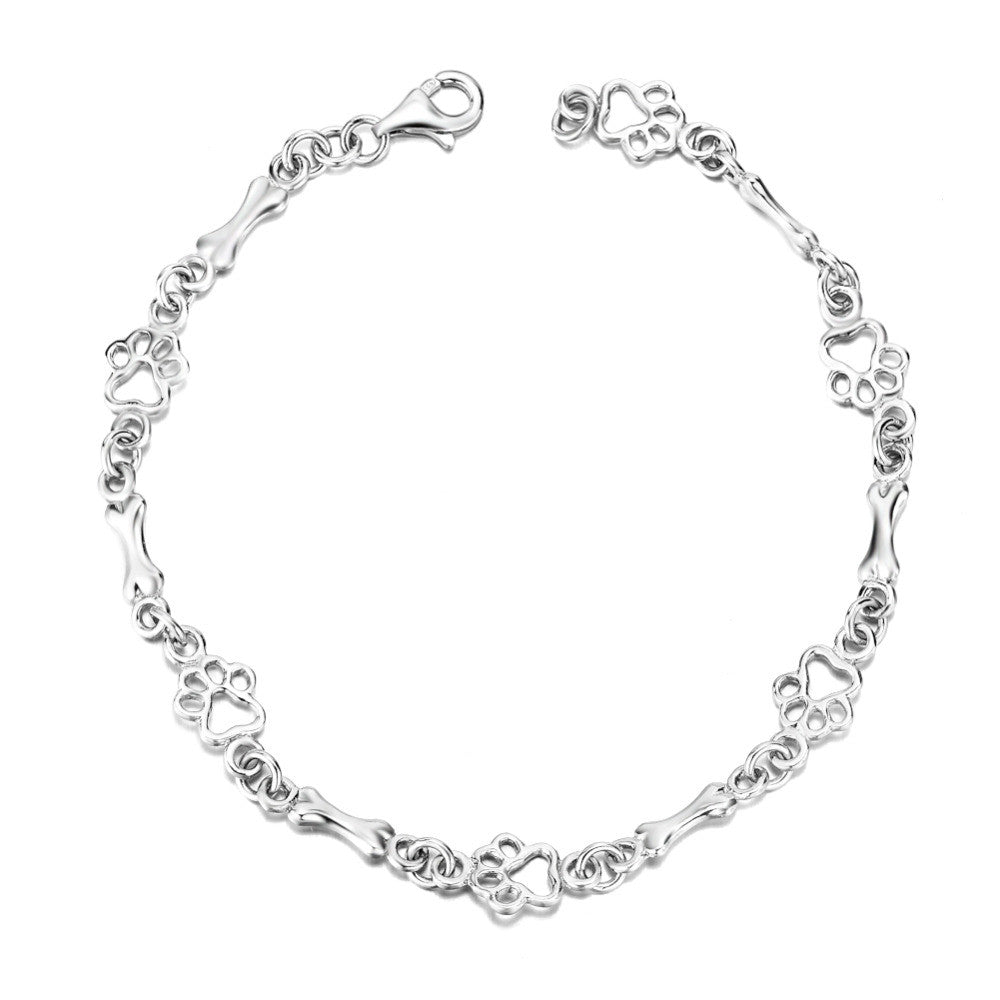 Pulsera con Patas de Perro Suspendidas y Hueso de Plata Bruta, Edición Limitada