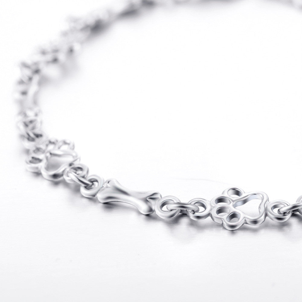 Pulsera con Patas de Perro Suspendidas y Hueso de Plata Bruta, Edición Limitada