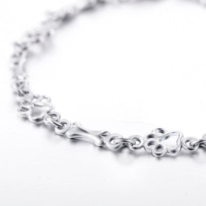 Pulsera con Patas de Perro Suspendidas y Hueso de Plata Bruta, Edición Limitada