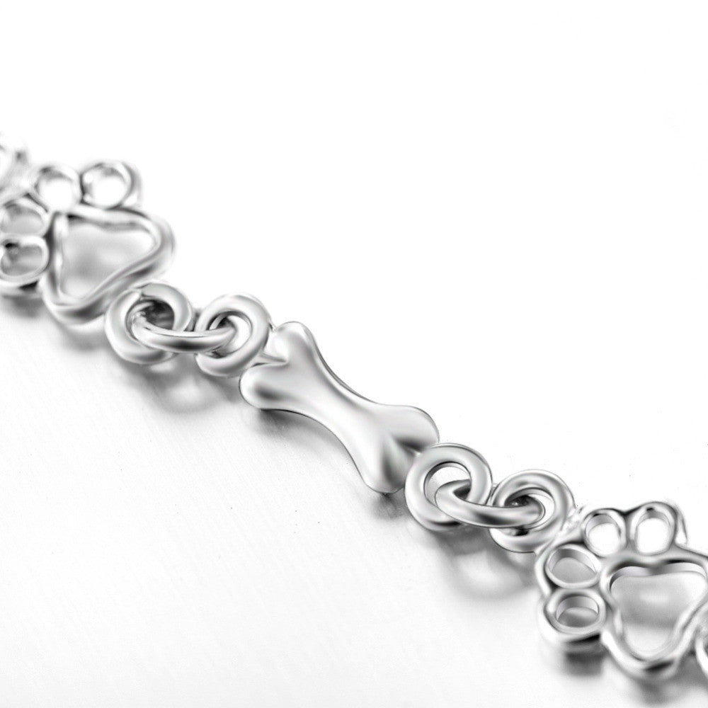 Pulsera con Patas de Perro Suspendidas y Hueso de Plata Bruta, Edición Limitada