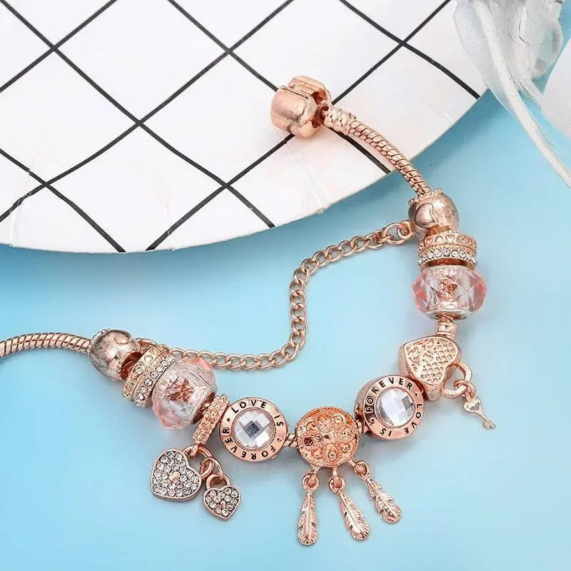 Pulsera de atrapasueños rosa con colgantes de plata