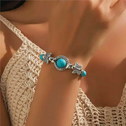 Pulsera de oro blanco con mariposas