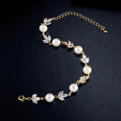 Pulsera retro con perlas y hojas en color oro